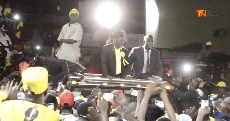 Thousands cheer Darboe at airport then escort him home in journey that lasted for six hours