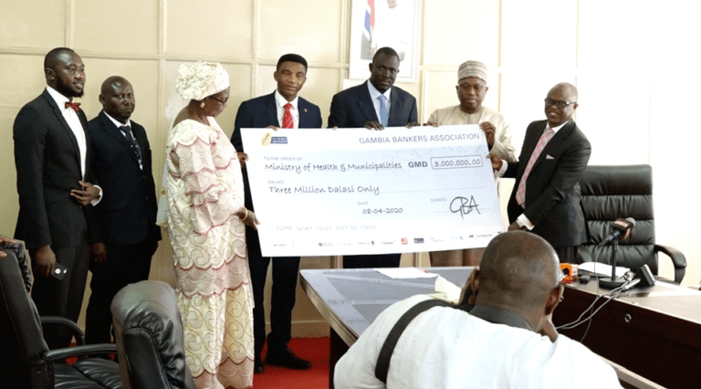 Bankers group gives THREE million dalasis to government as vice president reveals battle against coronavirus is a big fight