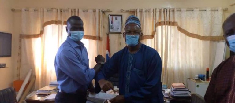 No hard feelings! Bakary Badjie and sacked Hadrammeh Sidibeh elbow-bump as they come face-to-face since reshuffle