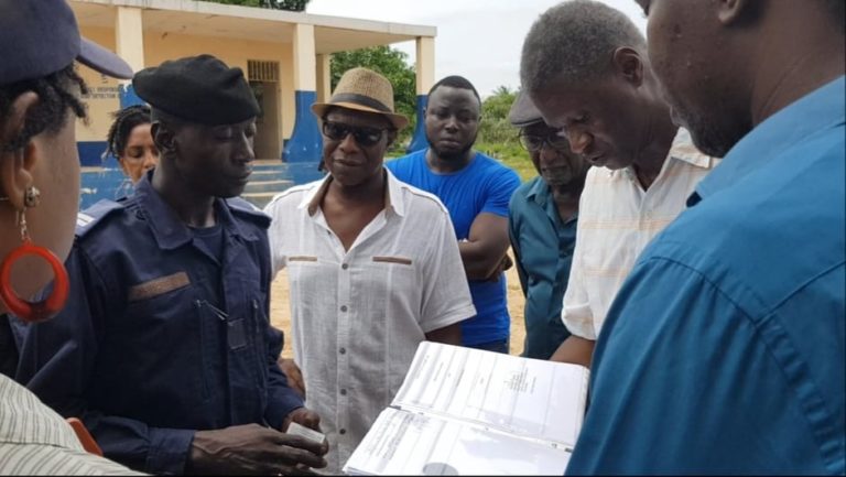 Police attempt to remove Global HOMM officials from their Bijilo row-gripped property