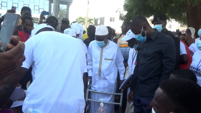 Darboe votes using his walking frame amid his recovery